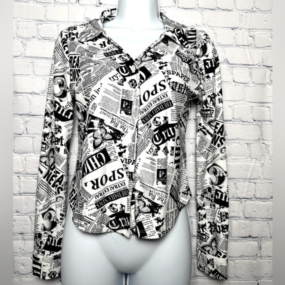 Black and white “newspaper” design button down waist length shirt